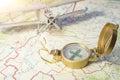Concept travel. a vintage compass on the map and an airplane Royalty Free Stock Photo