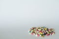Concept of treatment, options for forms of pharmacological preparations, backdrop of multicolored medicine pills and capsules