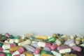 Concept of treatment, options for forms of pharmacological preparations, backdrop of multicolored medicine pills and capsules