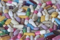 Concept of treatment, options for forms of pharmacological preparations, backdrop of multicolored medicine pills and capsules Royalty Free Stock Photo