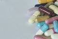 Concept of treatment, options for forms of pharmacological preparations, backdrop of multicolored medicine pills and capsules Royalty Free Stock Photo