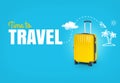 Concept trip with text Time to Travel. Bright yellow suitcase