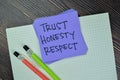 Concept of Trust, Honesty, Respect write on sticky notes isolated on Wooden Table Royalty Free Stock Photo