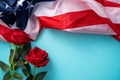 Concept of Independence day or Memorial day. American Flag over blue table background with red rose Royalty Free Stock Photo