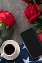 Concept of Independence day or Memorial day with smart phone and coffee. Flag over dark gray table background