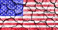 Concept of United States of America hardship times and drought with dry cracked soil and american flag Royalty Free Stock Photo