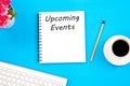 Concept Upcoming Events message on notebook, keyboard,with penci