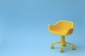 Concept of vacant chair. Yellow stool on blue clean background. Photo in minimal style Royalty Free Stock Photo