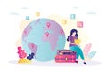 Concept of vacation planning, world navigation and tourism. Cute woman sits on luggages with world map. Female tourist choose