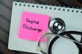 Concept of Vaginal Discharge write on sticky notes with stethoscope isolated on Wooden Table