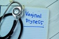 Concept of Vaginal Dryness write on book with stethoscope isolated on Wooden Table Royalty Free Stock Photo