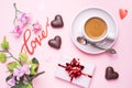 Concept Valentine`s Day. Chocolate candies and coffee, hearts on a pink background. Flat lay copy space. Greeting card and gift Royalty Free Stock Photo