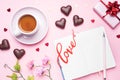 Concept Valentine`s Day. Chocolate candies and coffee, hearts on a pink background. Flat lay copy space. Greeting card