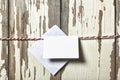 Concept: Valentine`s Day. Envelope for a love letter on a red rope on a wooden white background Royalty Free Stock Photo