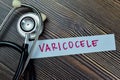 Concept of Varicocele write on sticky notes with stethoscope isolated on Wooden Table Royalty Free Stock Photo