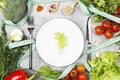 Concept variety of dietary/vegetarian food. White plate and lettuce leaf. Various vegetables (broccoli, pepper, cherry Royalty Free Stock Photo