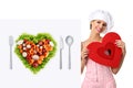 Concept vegetarian diet chef woman pointing billboard salad heart shape Royalty Free Stock Photo