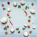 Concept of vegetarian food frame cauliflower tomato paste and red pepper parsley mushrooms rustic wooden background top view sp