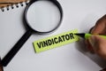Concept of vindicator write on sticky notes isolated on Wooden Table Royalty Free Stock Photo