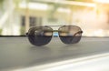 Concept vintage of sunglasses on the console car. Royalty Free Stock Photo