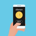 Concept of virtual business digital Ethereum cryptocurrency. Hand holds smartphone with Ethereum cryptocurrency and BUY button Royalty Free Stock Photo