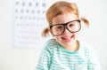 Concept vision testing. child girl with eyeglasses Royalty Free Stock Photo