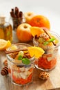 Concept of vitamin healthy salad with carrot, apples, orange, mi