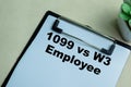 Concept of 1099 Vs W3 Employee write on paperwork isolated on wooden background