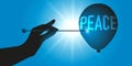 A hand points to a needle on a ball on which the word peace is written. Royalty Free Stock Photo