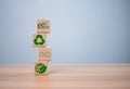 concept of waste reduction. Pollution. Reuse. Efficient use of resources. Environmental protection sign by recycling on wooden