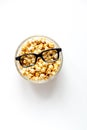 Concept of watching movies with popcorn top view white background Royalty Free Stock Photo