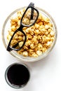 Concept of watching movies with popcorn top view white background Royalty Free Stock Photo