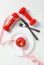 Concept of weight loss and healthy nutrition with apple and measuring tape Royalty Free Stock Photo