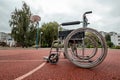 The concept of a wheelchair on the sports ground, a disabled person, a fulfilling life, paralyzed. Wheelchair on the basketball