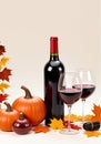 Wine Glasses With A Red Wine Bottle And Autumn Decorations Isolated On A White Background. Generative AI Royalty Free Stock Photo