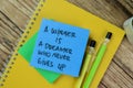 Concept of A Winner is A Dreamer Who Never Gives Up write on sticky notes isolated on Wooden Table Royalty Free Stock Photo