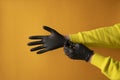 Concept, woman puts medical black gloves on her hands, protection 2019-nCoV Royalty Free Stock Photo