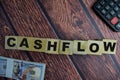 Concept of The wooden Cubes with the word Cashflow on wooden background