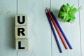 Concept of The wooden Cubes with the word URL on wooden background