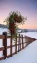 A Wooden Fence Adorned With Mistletoe, Set Against A Snowy Landscape At Dus. Generative AI