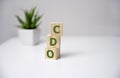 Concept word `CDO` on cubes on a beautiful white background. Business concept Royalty Free Stock Photo