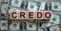 Concept word `credo` on cubes on a beautiful background from dollar bills. Business concept