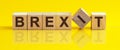 Concept word forming with cube on wooden desk background - Brexit Royalty Free Stock Photo