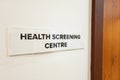Concept of the word Health Screening Centre at the door entrance of hospital