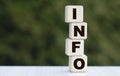 The concept of the word INFO on cubes on a beautiful green background Royalty Free Stock Photo