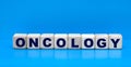 Concept word oncology on cubes on a blue background