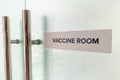 Concept of the word Vaccine Room at the door entrance of hospital