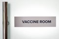 Concept of the word Vaccine Room at the door entrance of hospital