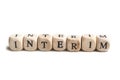 Concept word on wooden cube - Interim Royalty Free Stock Photo