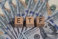 Concept words ETF on wooden blocks, acronym ETF which refers to Exchange Traded Fund inscribed on wooden cubes United States